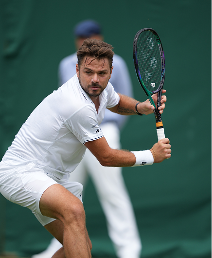 Stan Wawrinka playing a one-handed backhand on grass