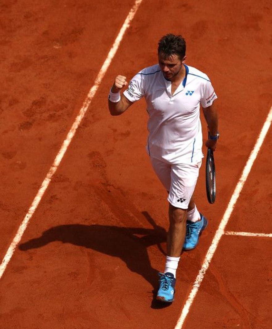 Stan Wawrinka celebrating on the clay at Roland-Garros in 2003